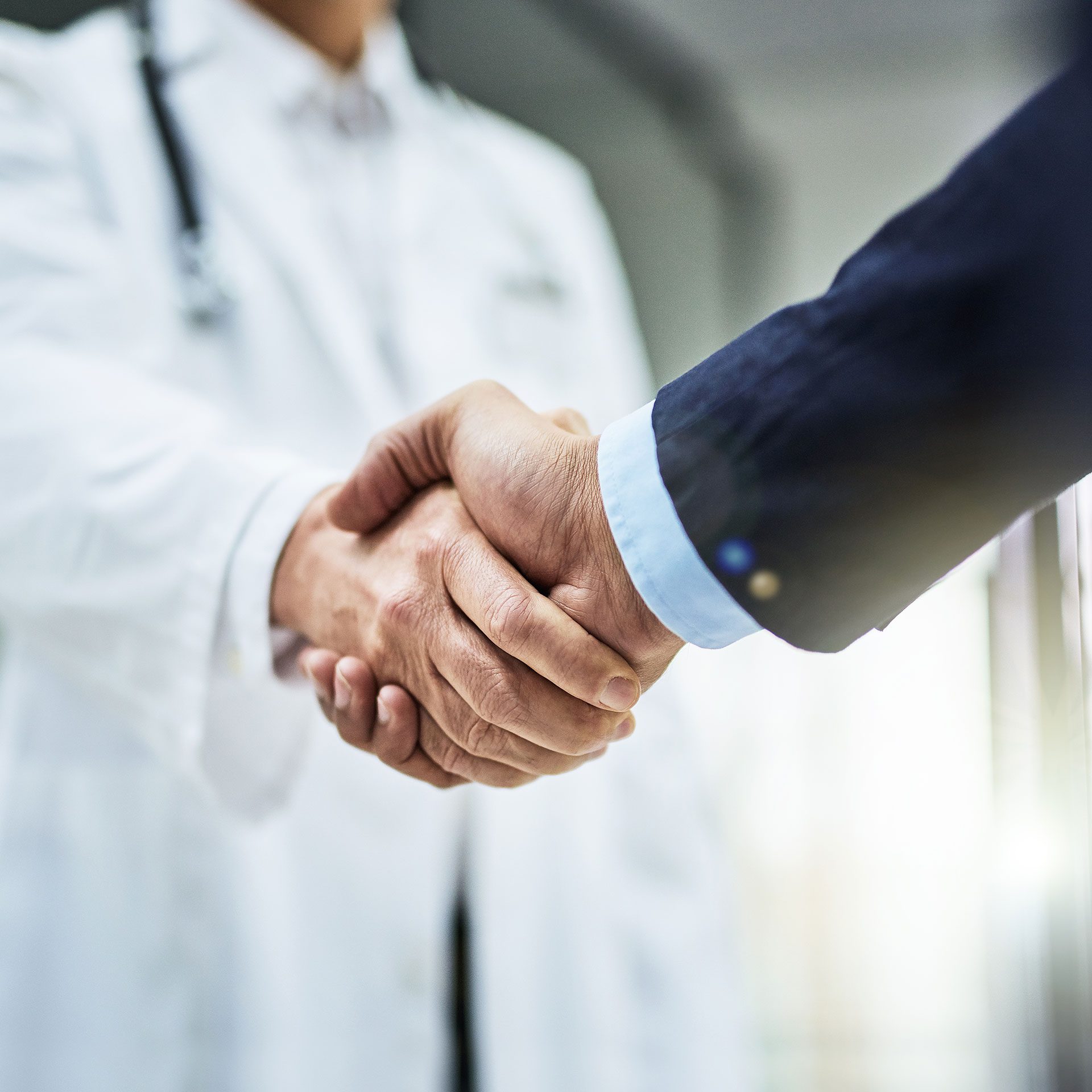 Doctor and customer handshake
